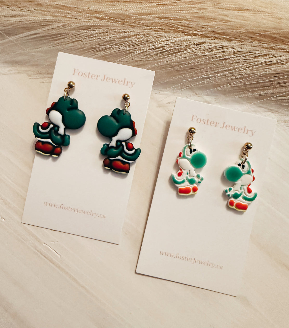 Green dinosaur earrings