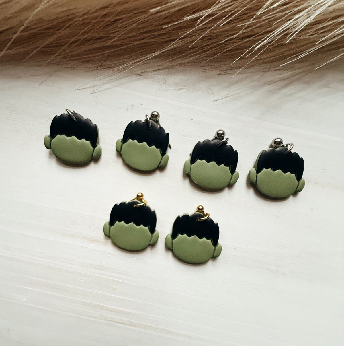 Big green guy earrings