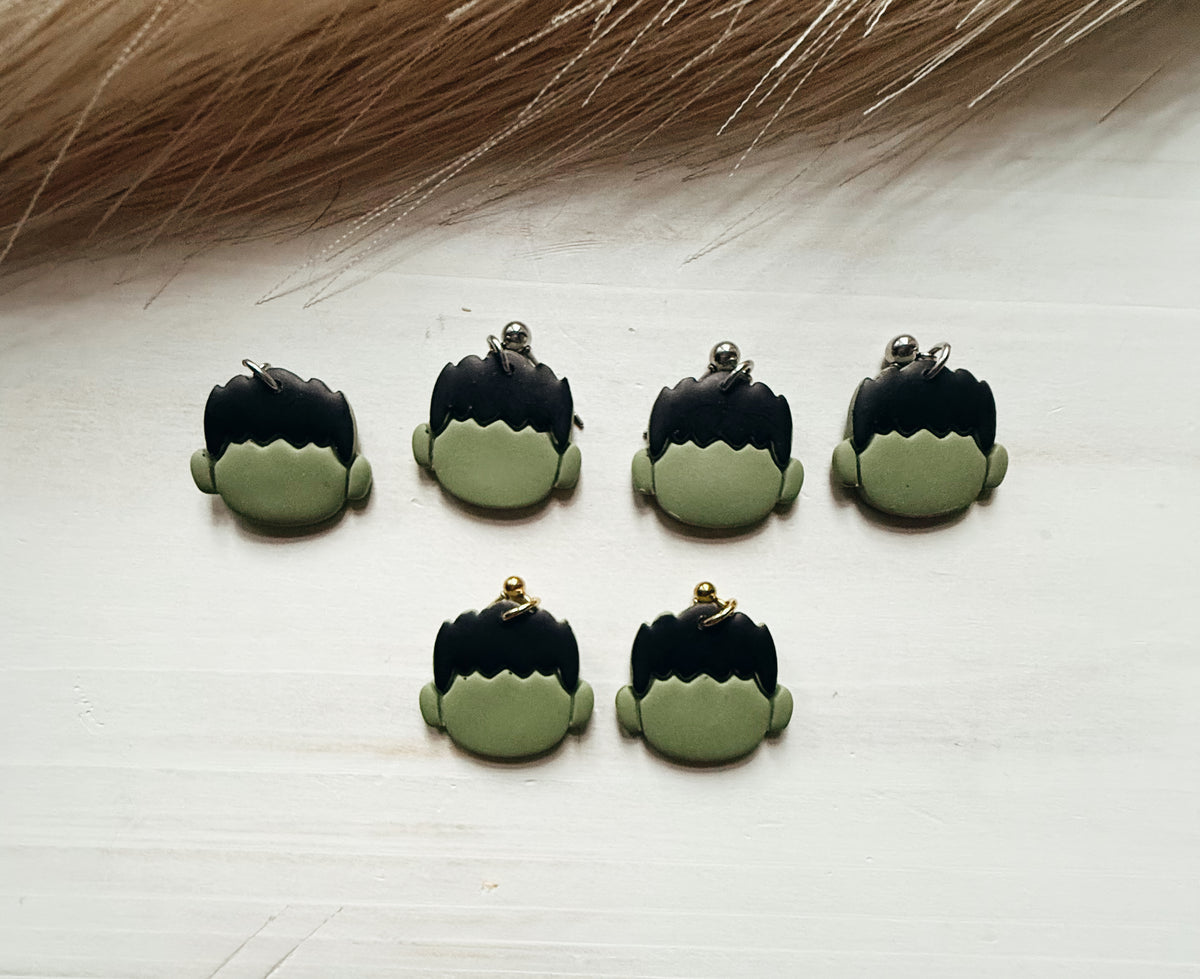 Big green guy earrings